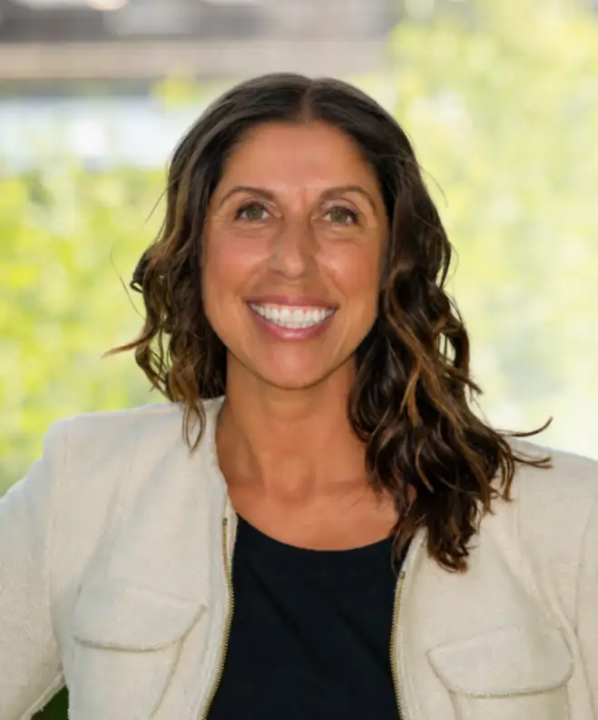 Anna Ielo-Tal, Candidate for Ward 9 Ottawa, wearing a relaxed smile and a white blazer